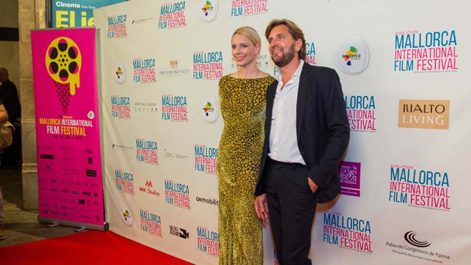 a man and woman posing for a picture