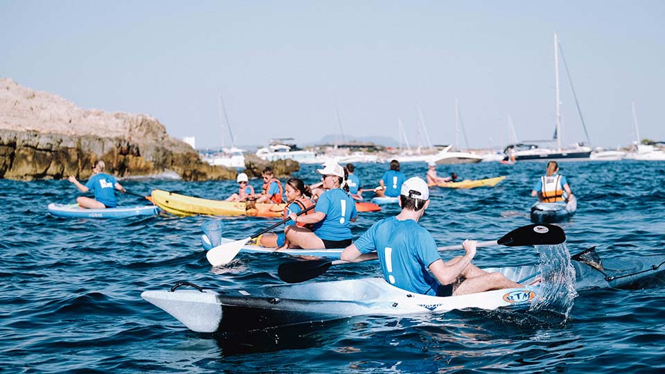 a group of people on kayaks in the water