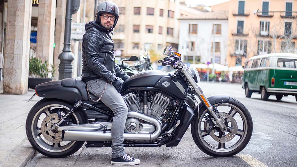 a person sitting on a motorcycle